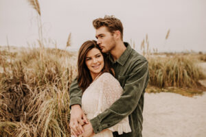 warm family beach photo shoot couples session on beach golden glow morning San Diego beach photographer