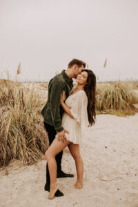 warm family beach photo shoot couples session on beach golden glow morning San Diego beach photographer