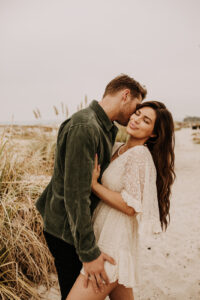 warm family beach photo shoot couples session on beach golden glow morning San Diego beach photographer