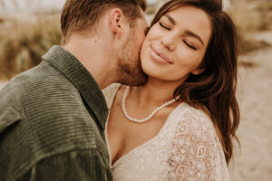 warm family beach photo shoot couples session on beach golden glow morning San Diego beach photographer