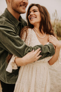 warm family beach photo shoot couples session on beach golden glow morning San Diego beach photographer