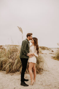 warm family beach photo shoot couples session on beach golden glow morning San Diego beach photographer