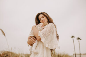 warm family beach photo shoot couples session on beach golden glow morning San Diego beach photographer