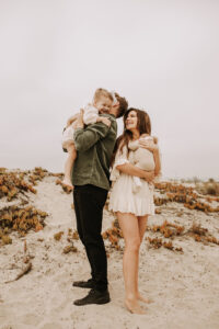 warm family beach photo shoot couples session on beach golden glow morning San Diego beach photographer