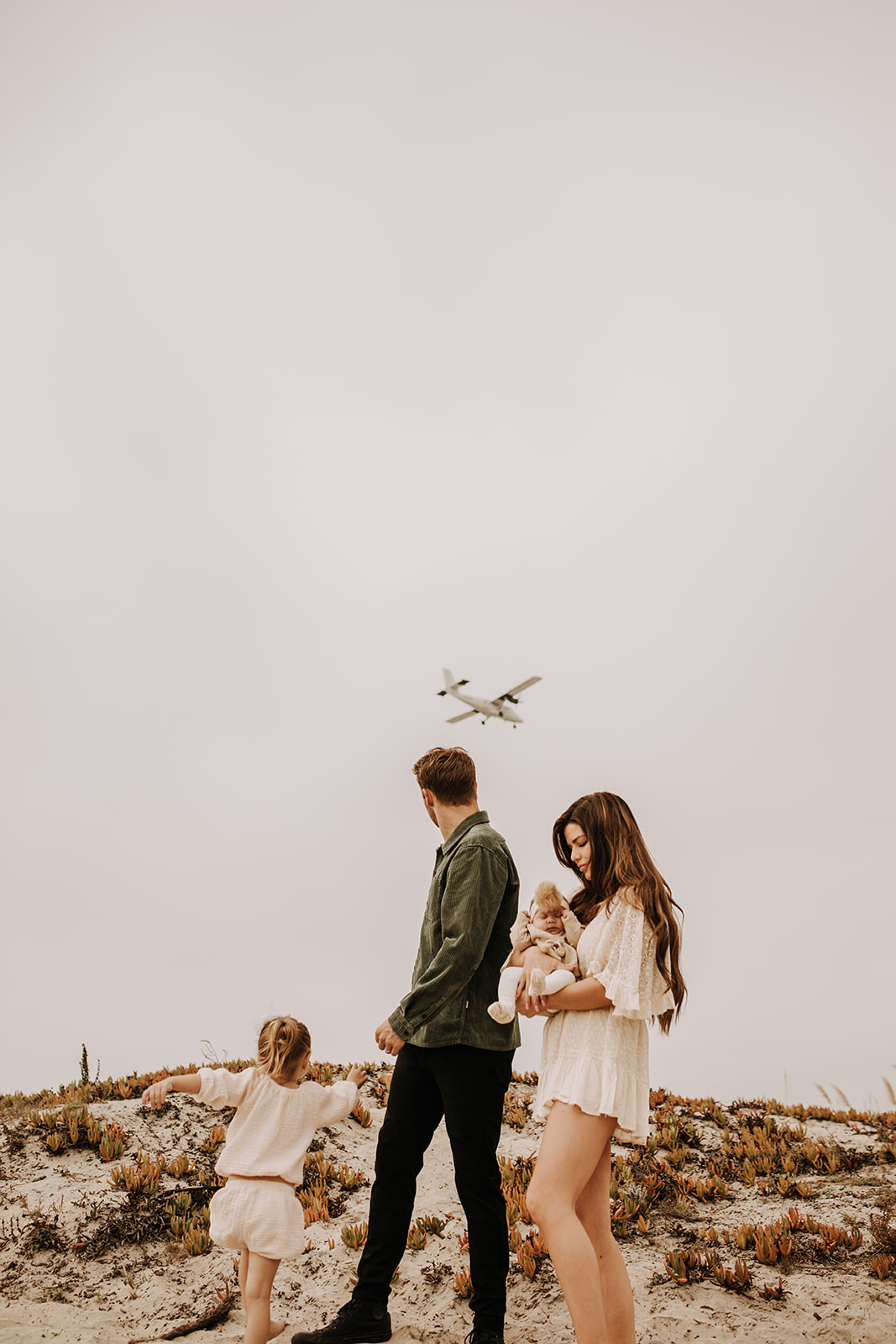 warm family beach photo shoot couples session on beach golden glow morning San Diego beach photographer