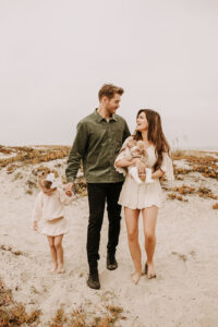 warm family beach photo shoot couples session on beach golden glow morning San Diego beach photographer