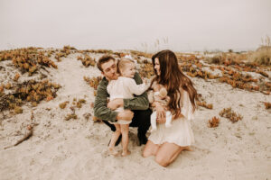 warm family beach photo shoot couples session on beach golden glow morning San Diego beach photographer