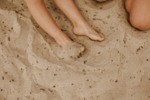 warm family beach photo shoot couples session on beach golden glow morning San Diego beach photographer