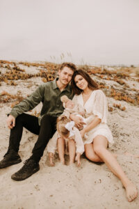 warm family beach photo shoot couples session on beach golden glow morning San Diego beach photographer