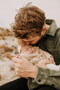 warm family beach photo shoot couples session on beach golden glow morning San Diego beach photographer