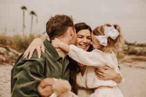 warm family beach photo shoot couples session on beach golden glow morning San Diego beach photographer