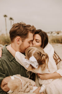 warm family beach photo shoot couples session on beach golden glow morning San Diego beach photographer