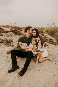 warm family beach photo shoot couples session on beach golden glow morning San Diego beach photographer