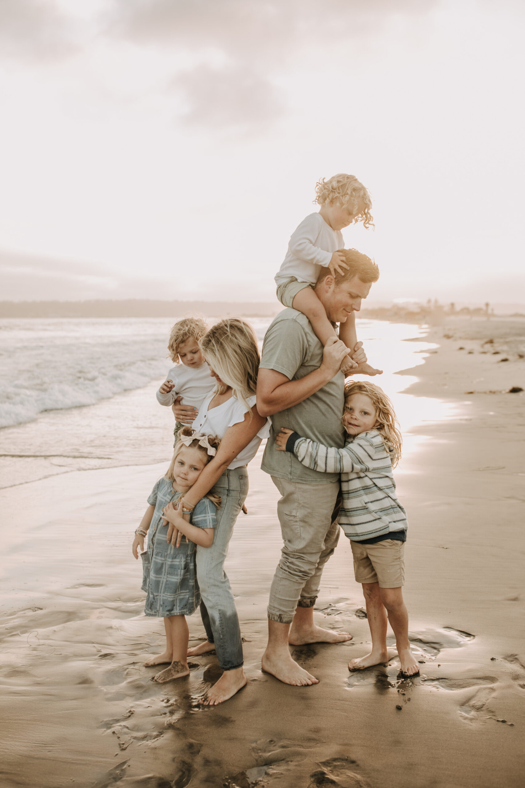 This gorgeous family beach session in San Diego is forever going to be one of my favorites. The warm tones are so perfect. By San Diego family Photographer Sabrina Kinsella.