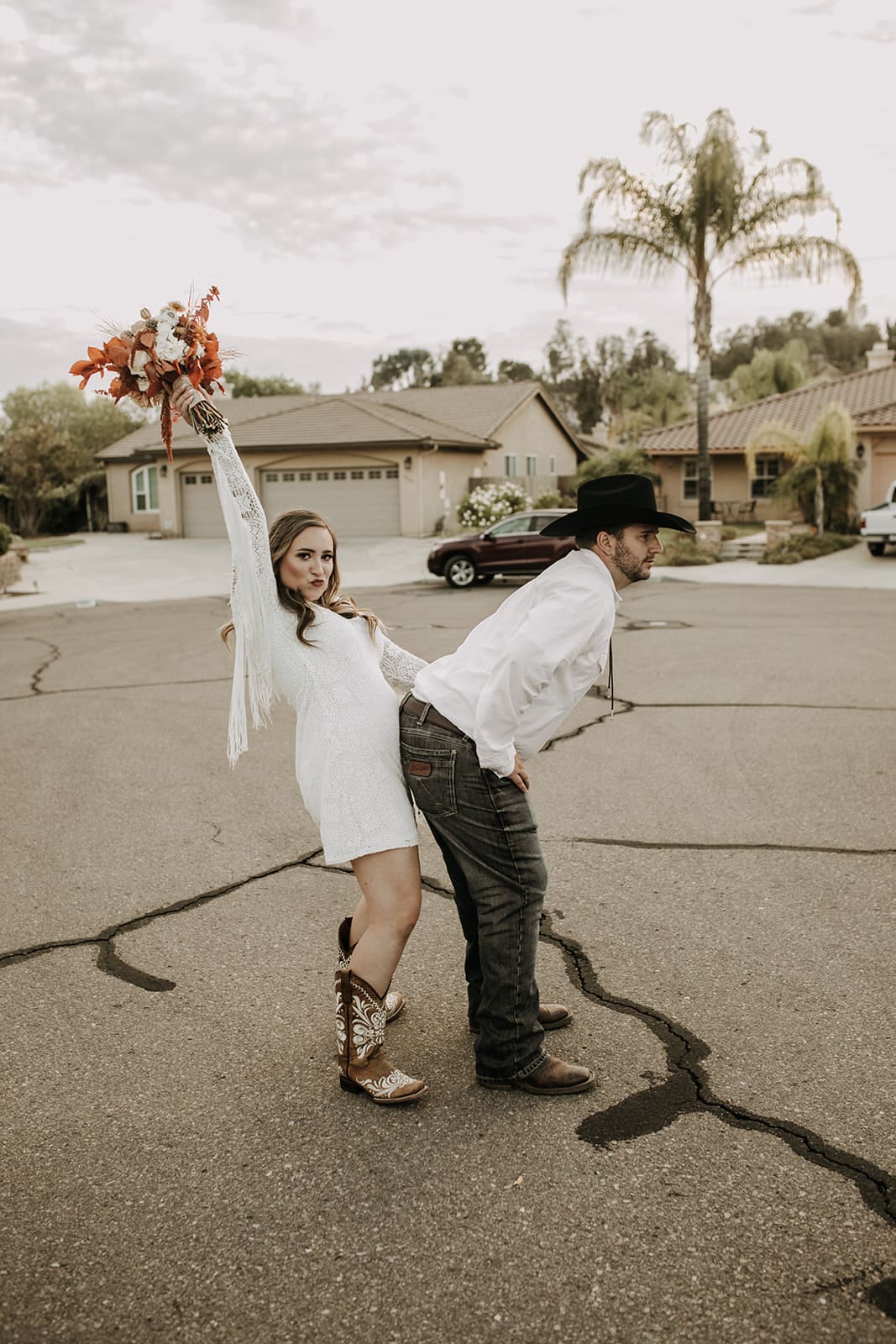 outdoor wedding backyard wedding wedding dress wedding florals western wedding rustic wedding small intimate backyard wedding bride and groom marriage just married wedding party wedding reception photos wedding photography wedding photographer San Diego wedding photographer sabrina kinsella