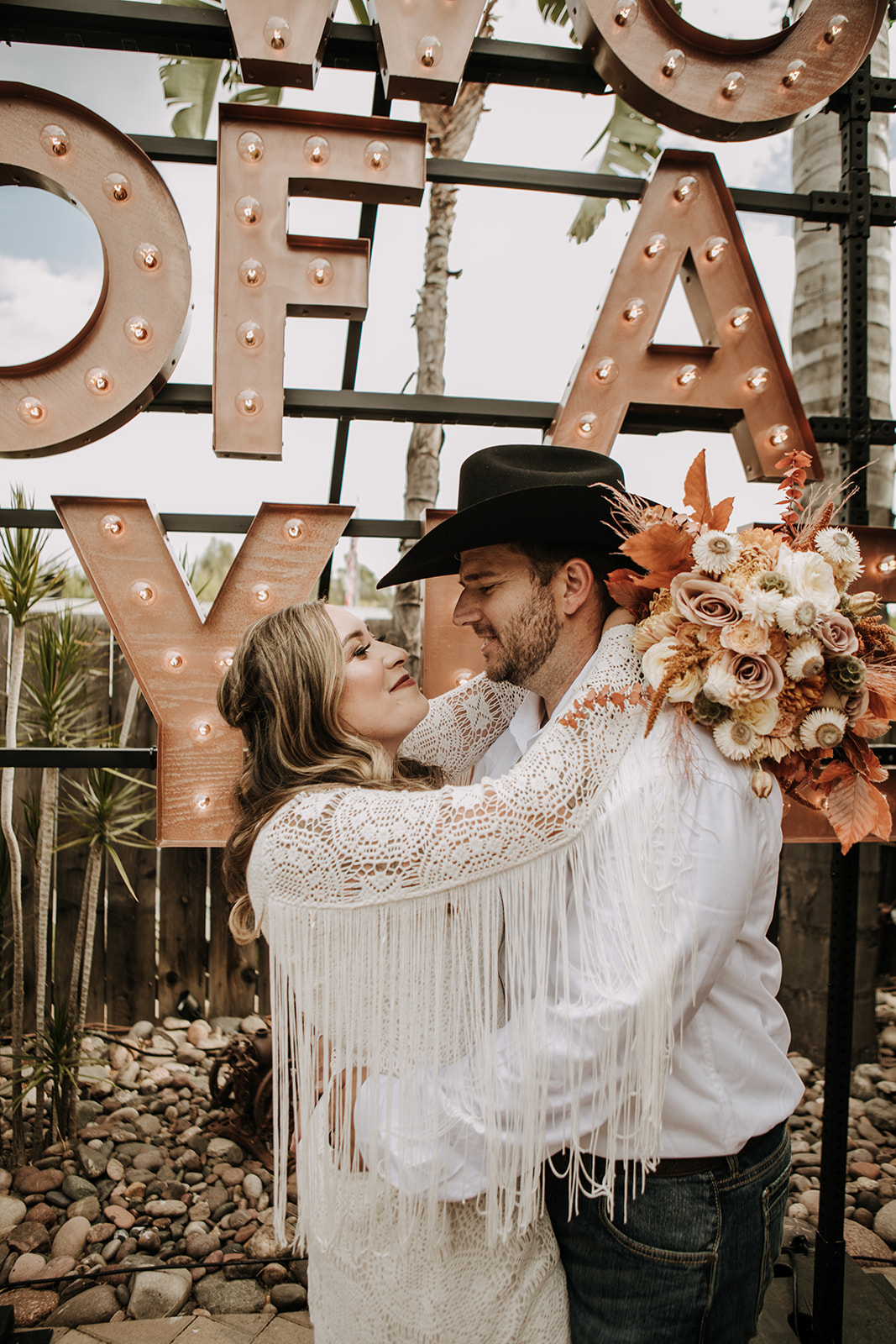 outdoor wedding backyard wedding wedding dress wedding florals western wedding rustic wedding small intimate backyard wedding bride and groom marriage just married wedding party wedding reception photos wedding photography wedding photographer San Diego wedding photographer sabrina kinsella 