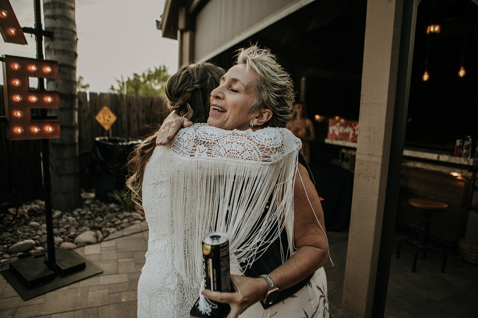 outdoor wedding backyard wedding wedding dress wedding florals western wedding rustic wedding small intimate backyard wedding bride and groom marriage just married wedding party wedding reception photos wedding photography wedding photographer San Diego wedding photographer sabrina kinsella 