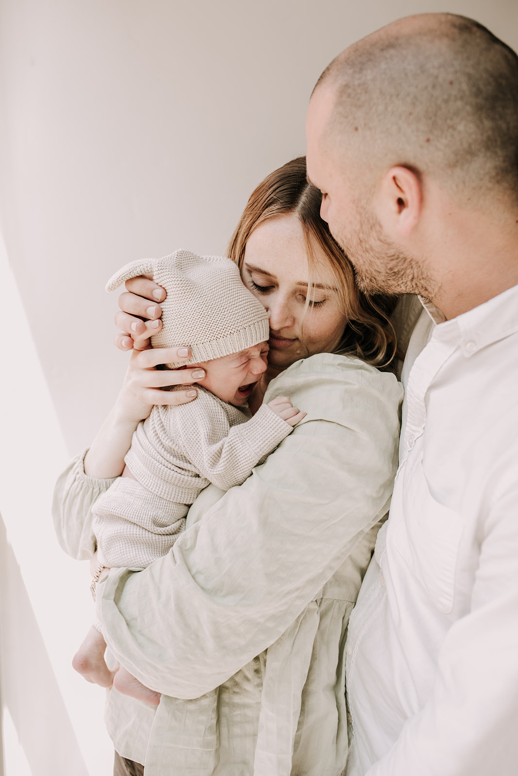 in home newborn photos newborn baby infant family photos in home family session San Diego family photographer Sabrina Kinsella