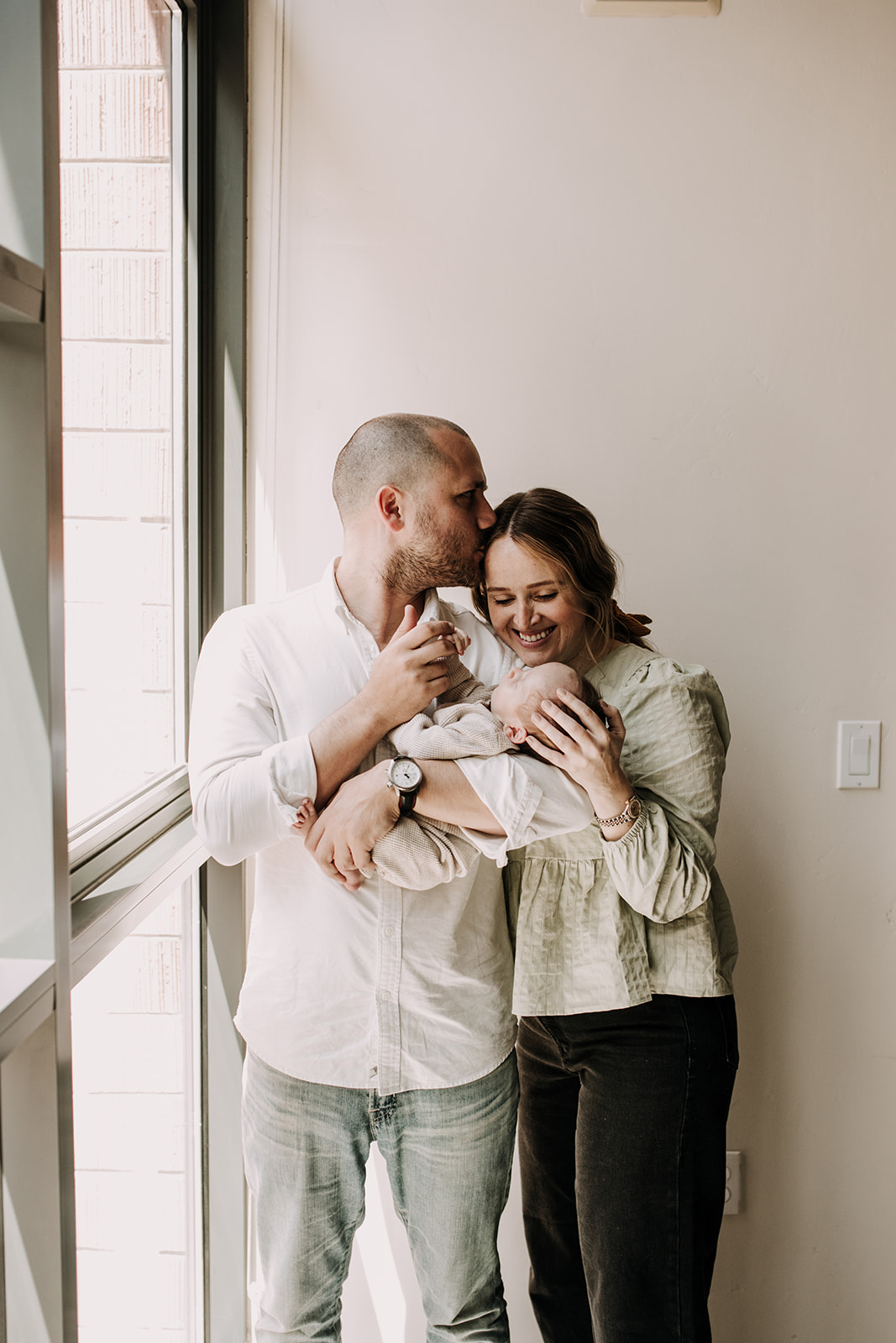 in home newborn photos newborn baby infant family photos in home family session San Diego family photographer Sabrina Kinsella