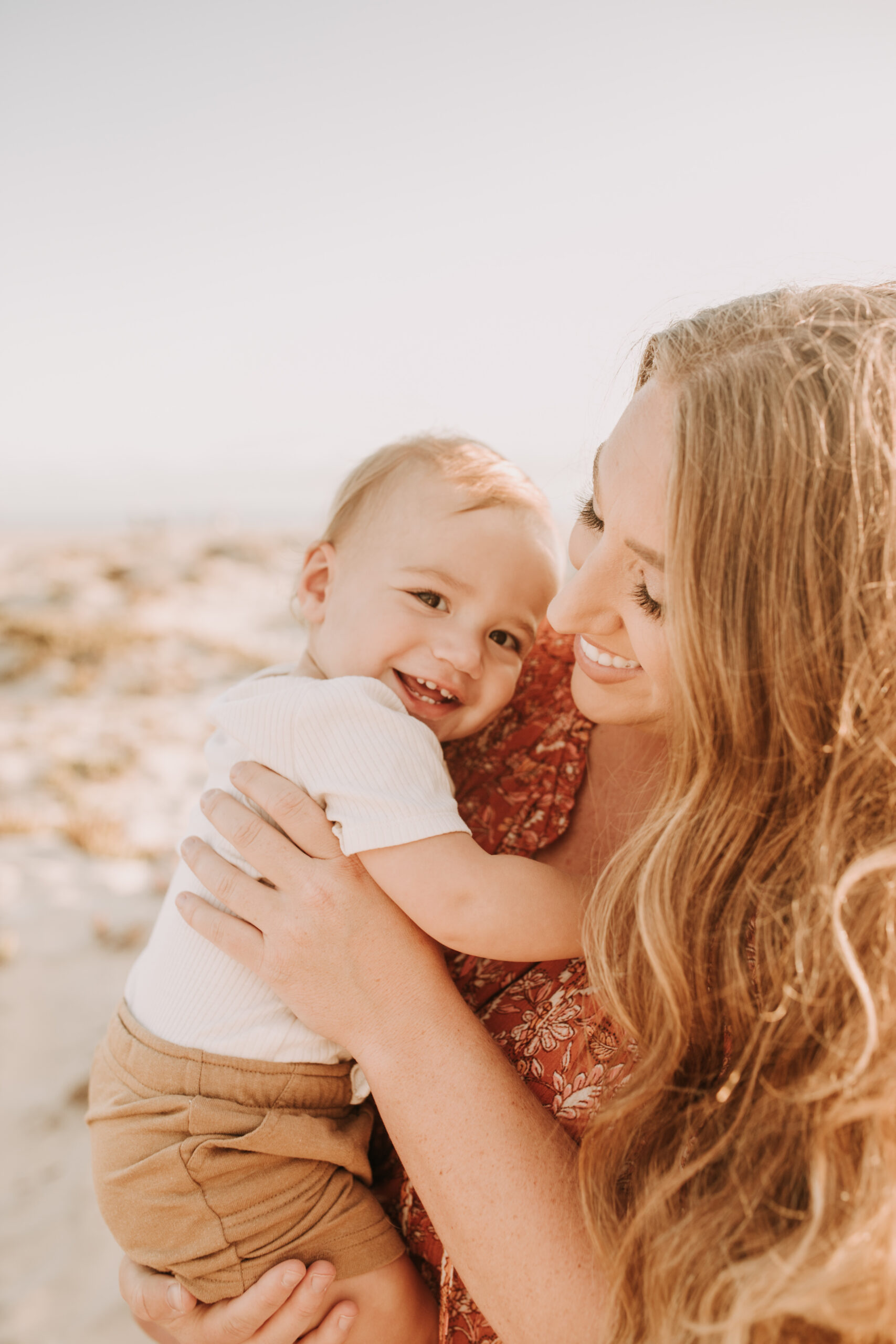 warm family beach session family p photos on the beach San Diego family photographer Sabrina kinsella