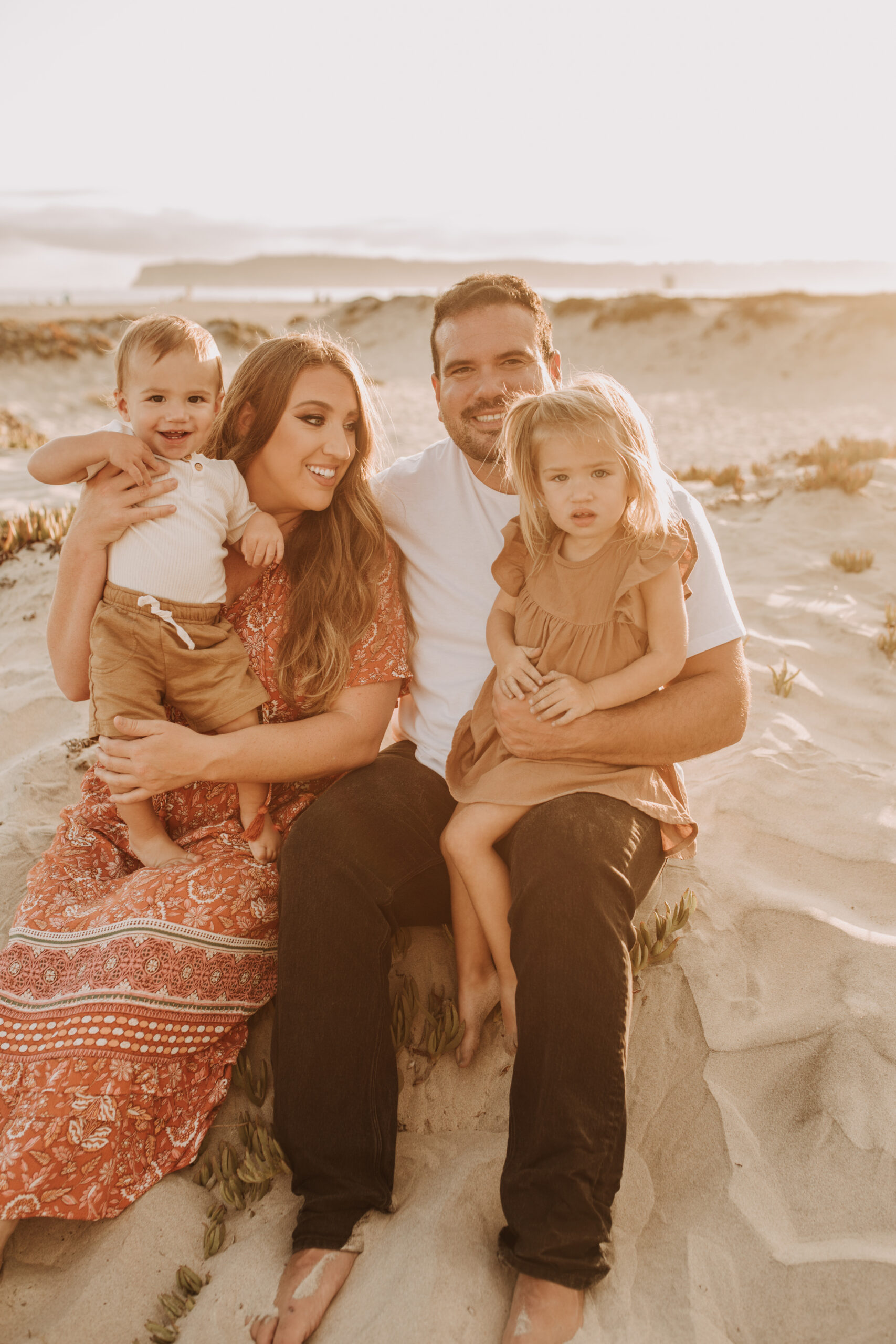 warm family beach session family p photos on the beach San Diego family photographer Sabrina kinsella