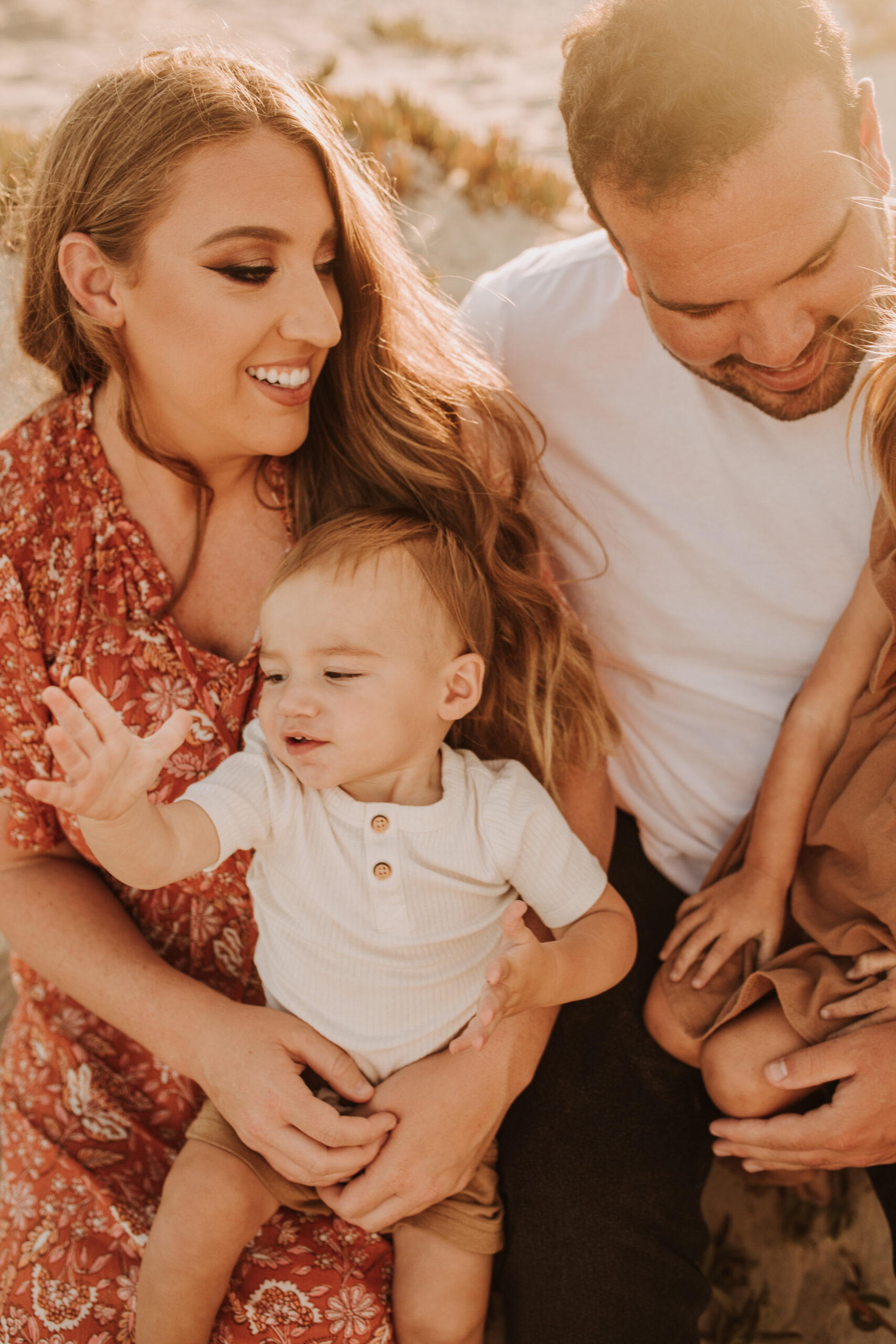 warm family beach session family p photos on the beach San Diego family photographer Sabrina kinsella