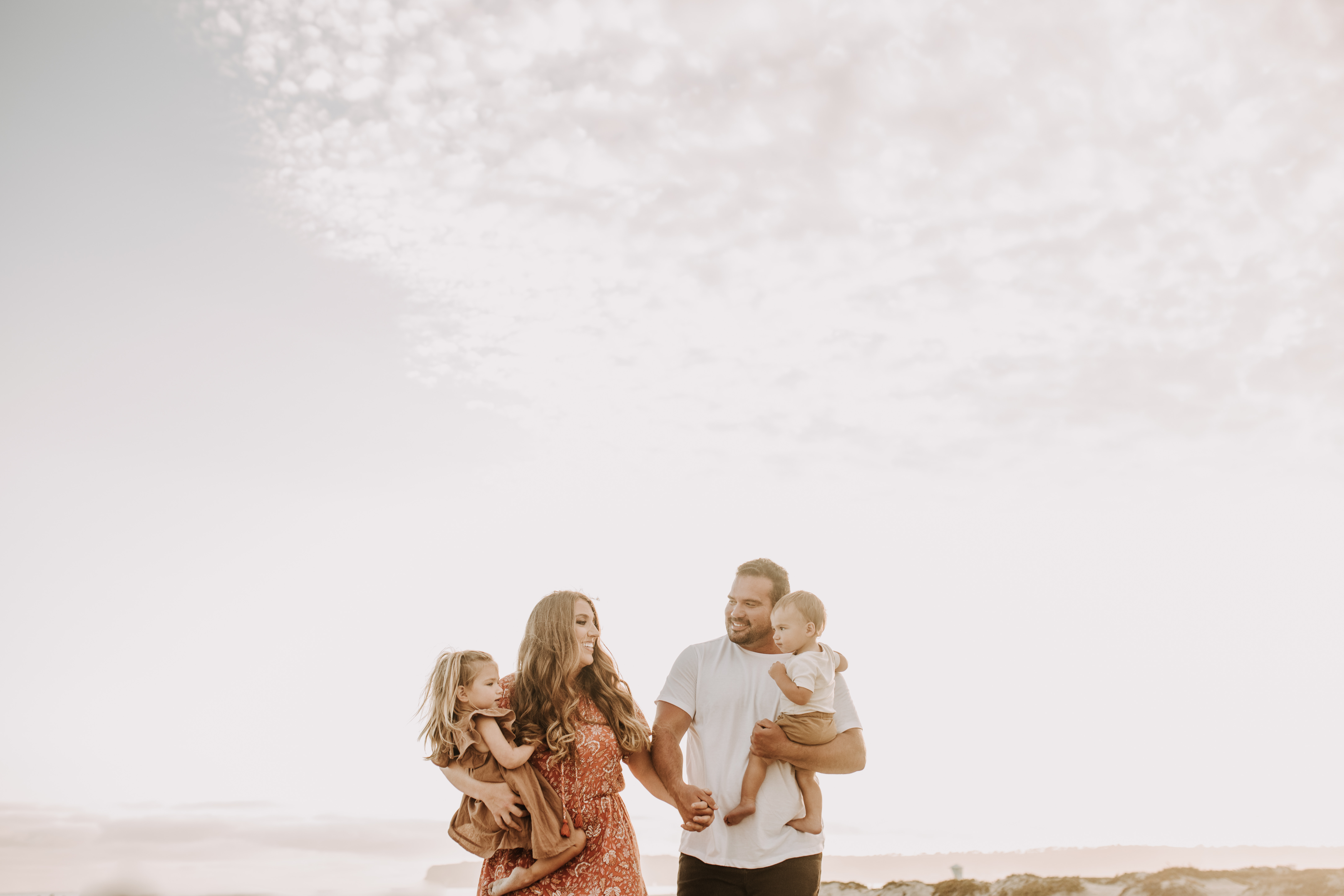 warm family beach session family p photos on the beach San Diego family photographer Sabrina kinsella