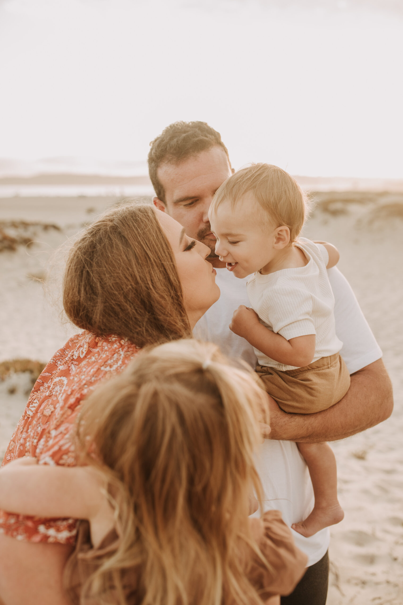 warm family beach session family p photos on the beach San Diego family photographer Sabrina kinsella