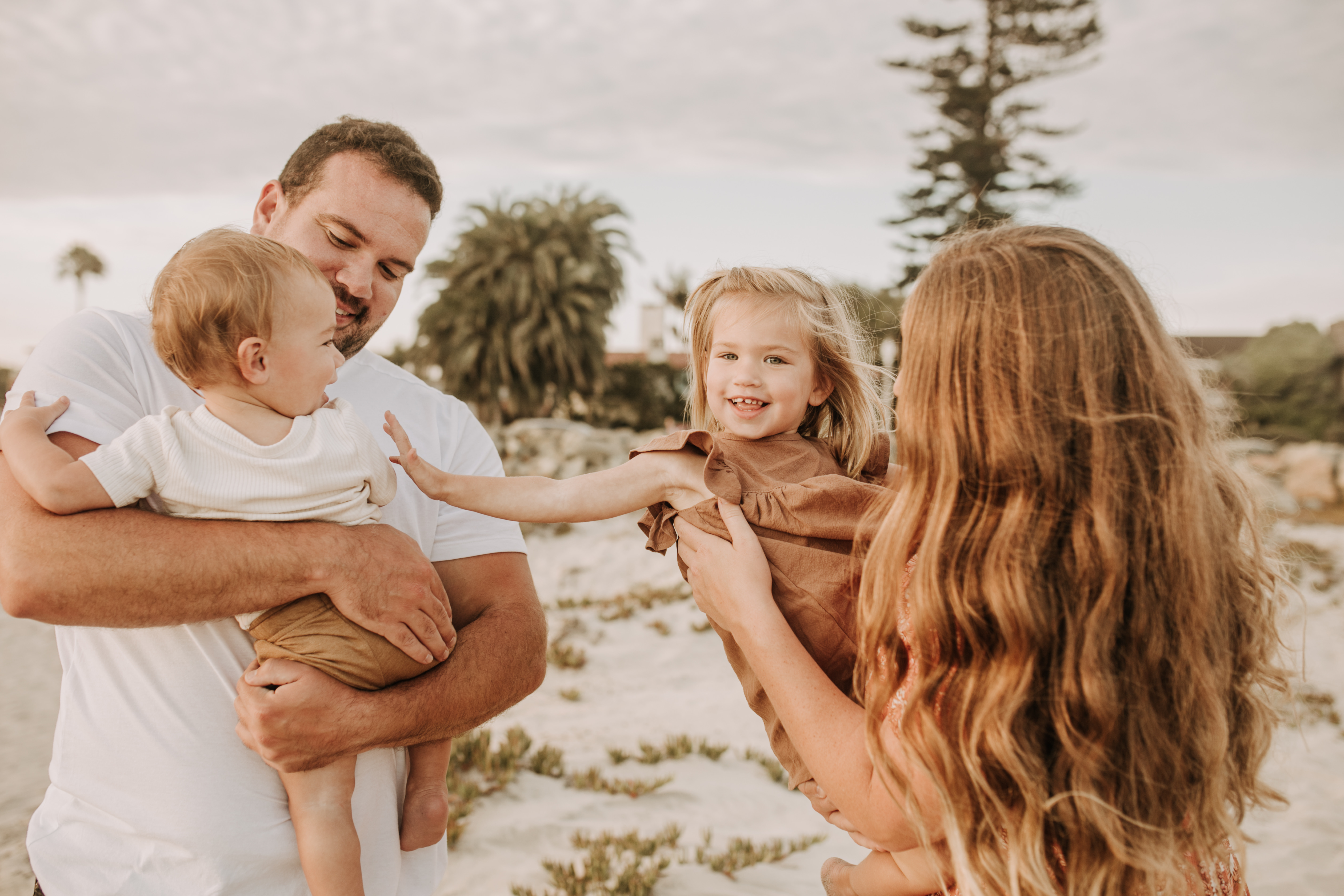 warm family beach session family p photos on the beach San Diego family photographer Sabrina kinsella