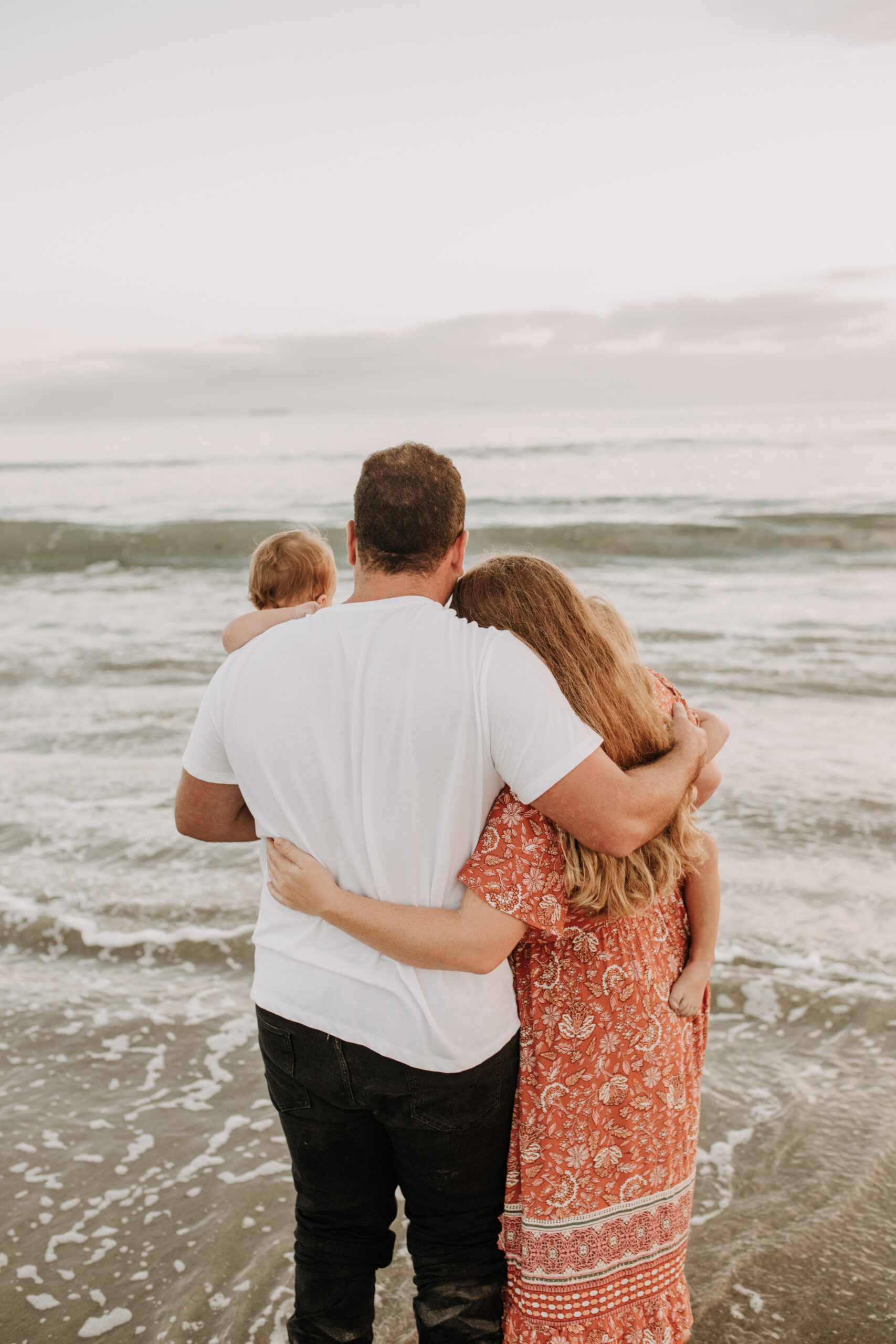 warm family beach session family p photos on the beach San Diego family photographer Sabrina kinsella