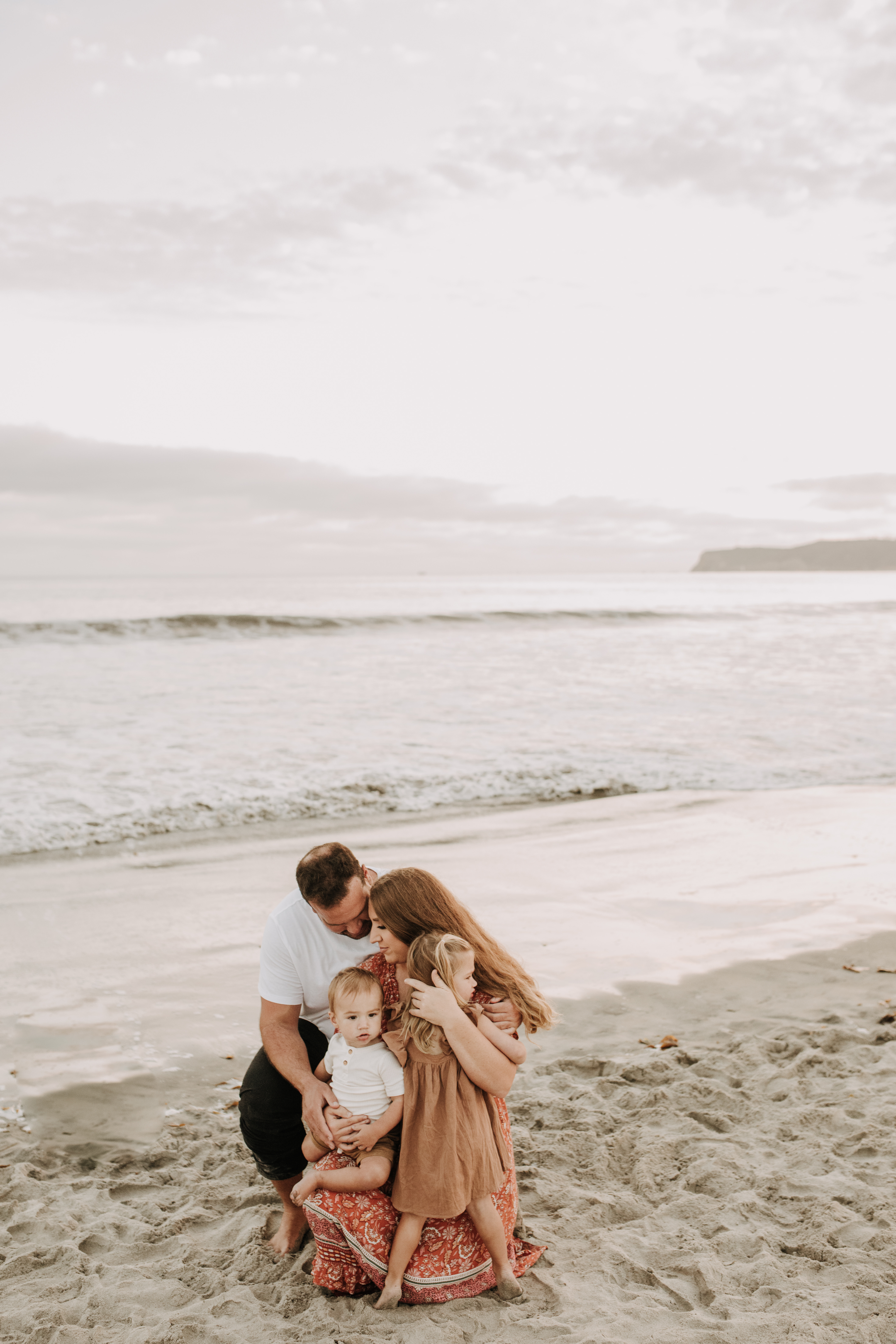 warm family beach session family p photos on the beach San Diego family photographer Sabrina kinsella