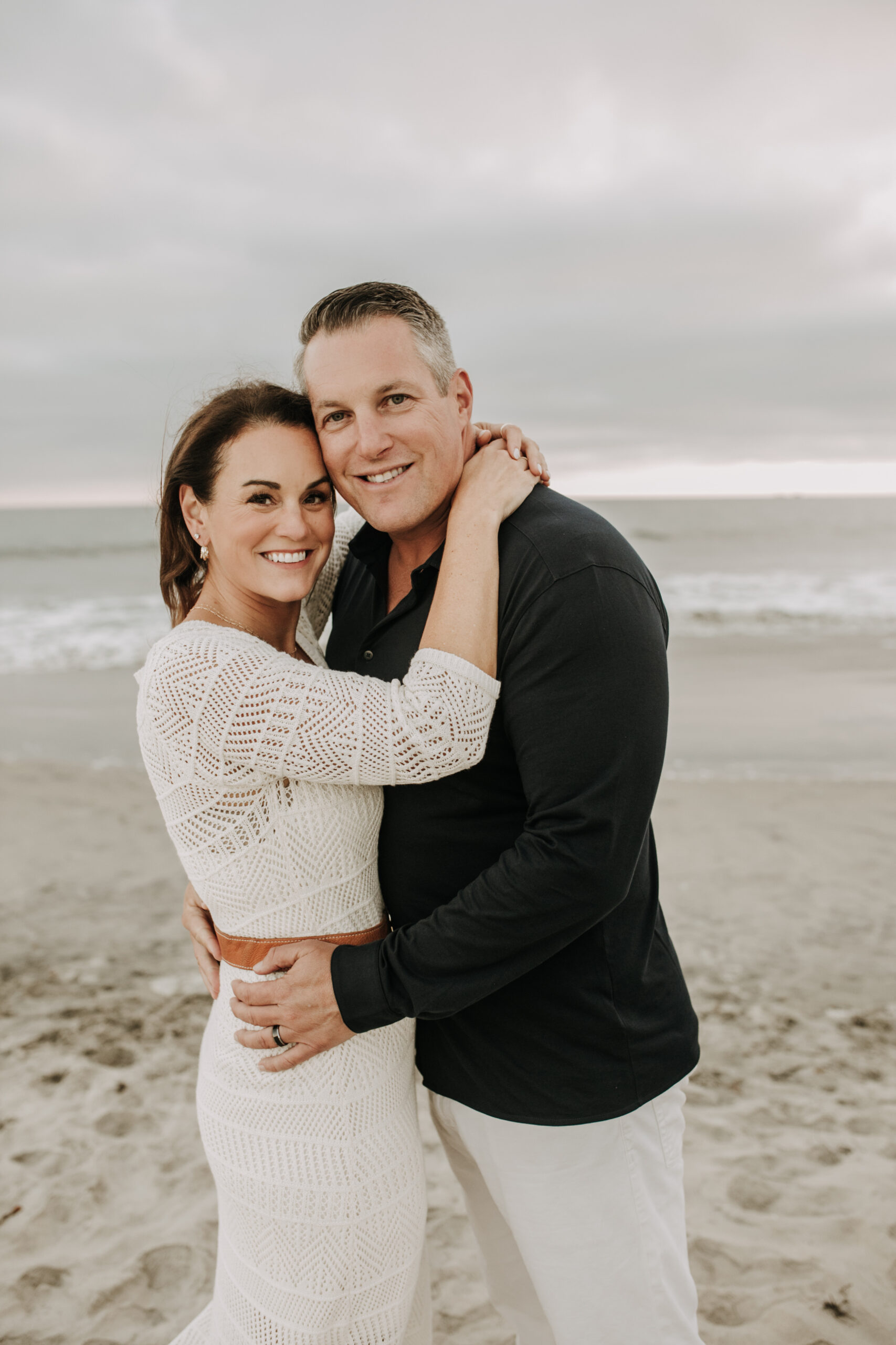 cool toned family photoshoot beach photos family photos on the beach cloudy vibes San Diego family photographer lifestyle photographer beach photoshoot inspo