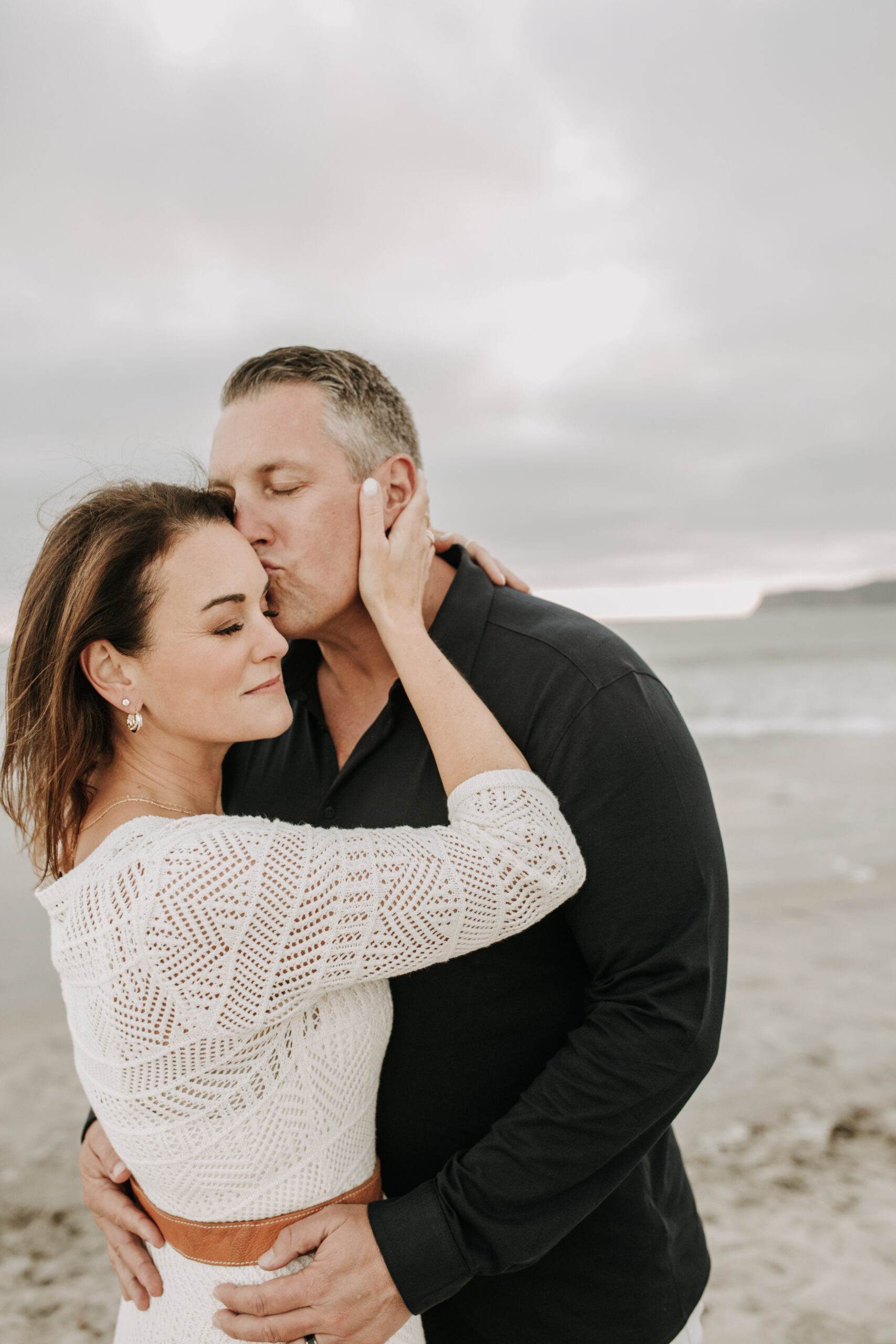 cool toned family photoshoot beach photos family photos on the beach cloudy vibes San Diego family photographer lifestyle photographer beach photoshoot inspo