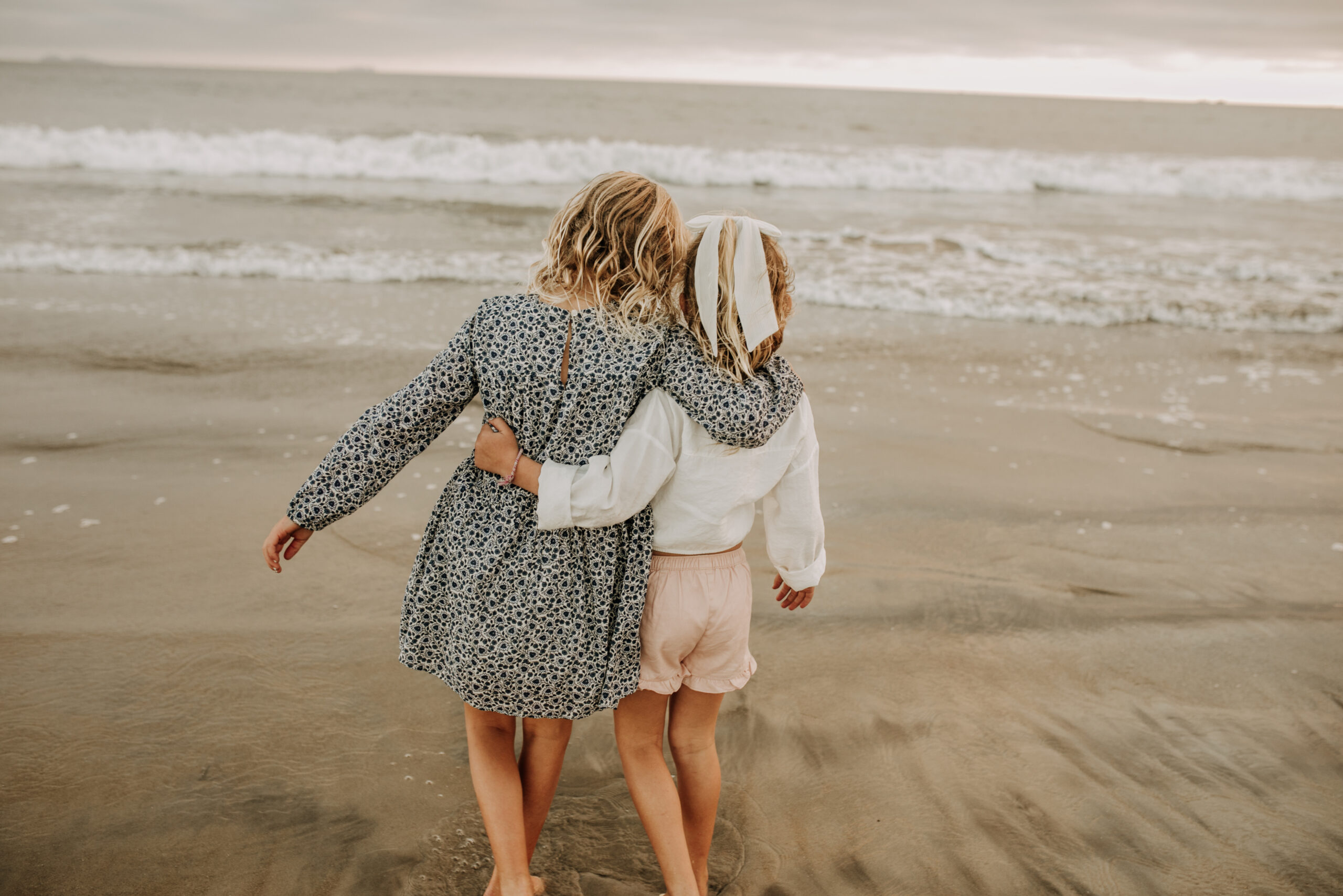 cool toned family photoshoot beach photos family photos on the beach cloudy vibes San Diego family photographer lifestyle photographer beach photoshoot inspo