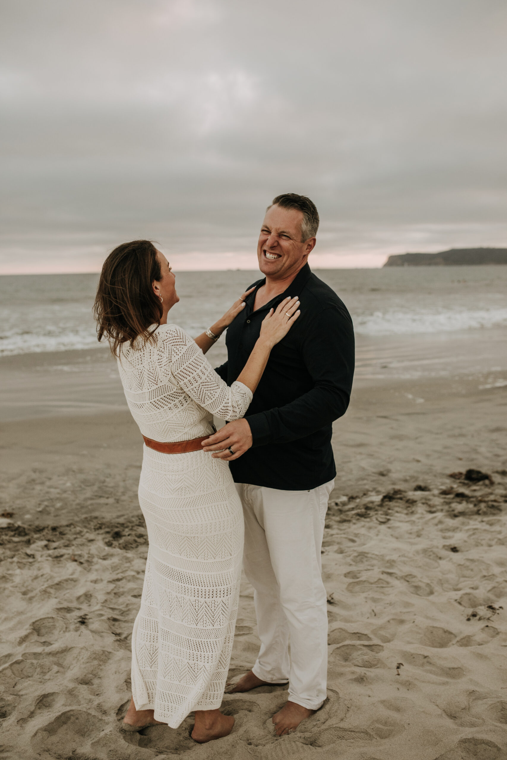 cool toned family photoshoot beach photos family photos on the beach cloudy vibes San Diego family photographer lifestyle photographer beach photoshoot inspo