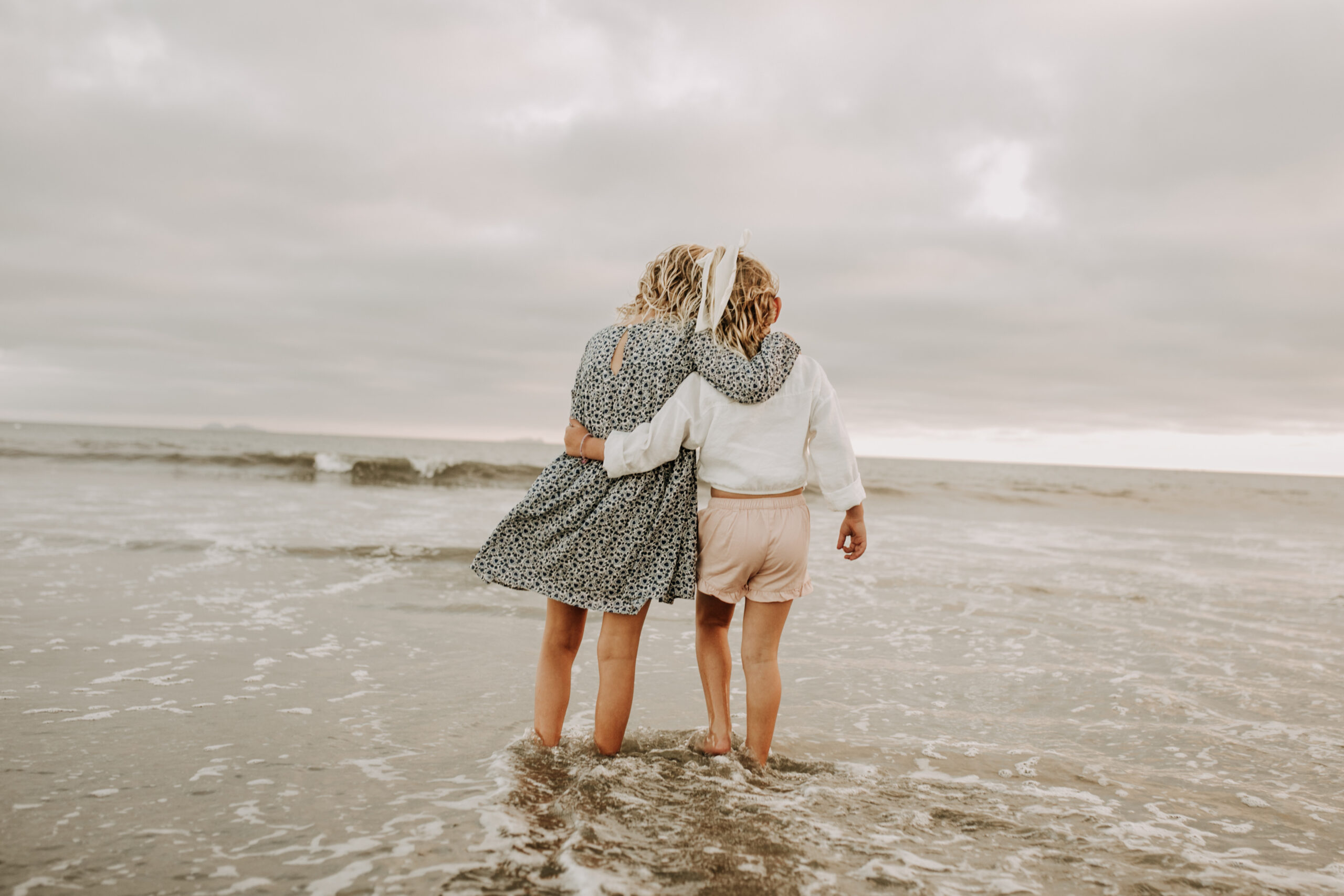 cool toned family photoshoot beach photos family photos on the beach cloudy vibes San Diego family photographer lifestyle photographer beach photoshoot inspo