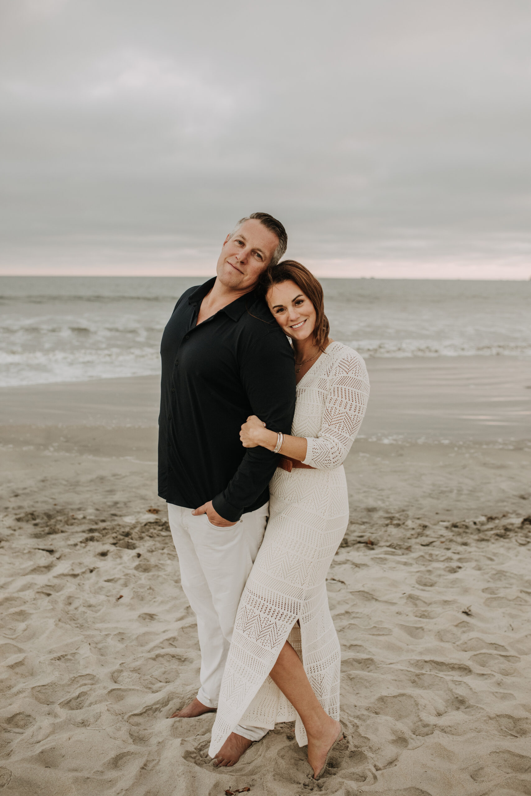 cool toned family photoshoot beach photos family photos on the beach cloudy vibes San Diego family photographer lifestyle photographer beach photoshoot inspo