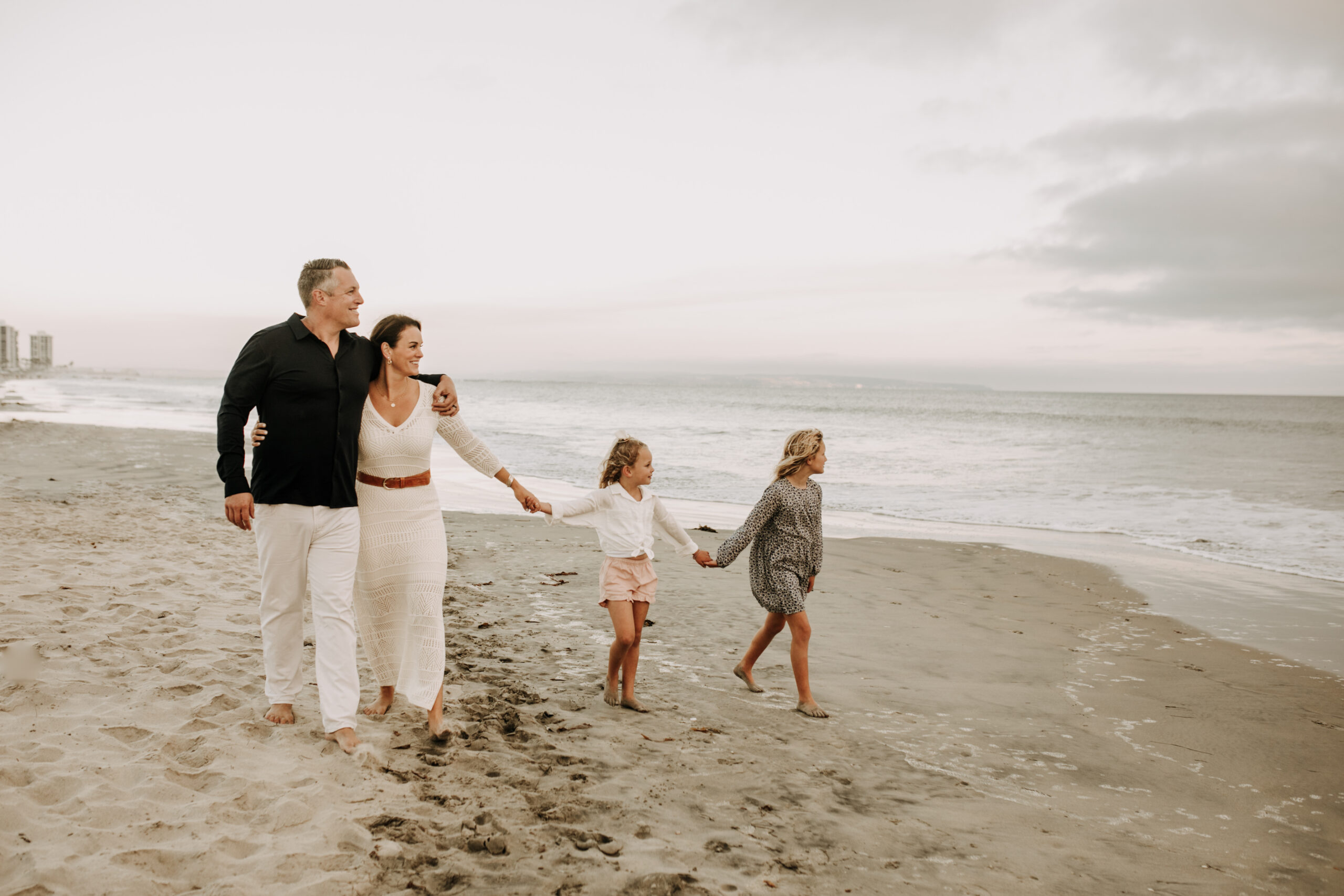 cool toned family photoshoot beach photos family photos on the beach cloudy vibes San Diego family photographer lifestyle photographer beach photoshoot inspo