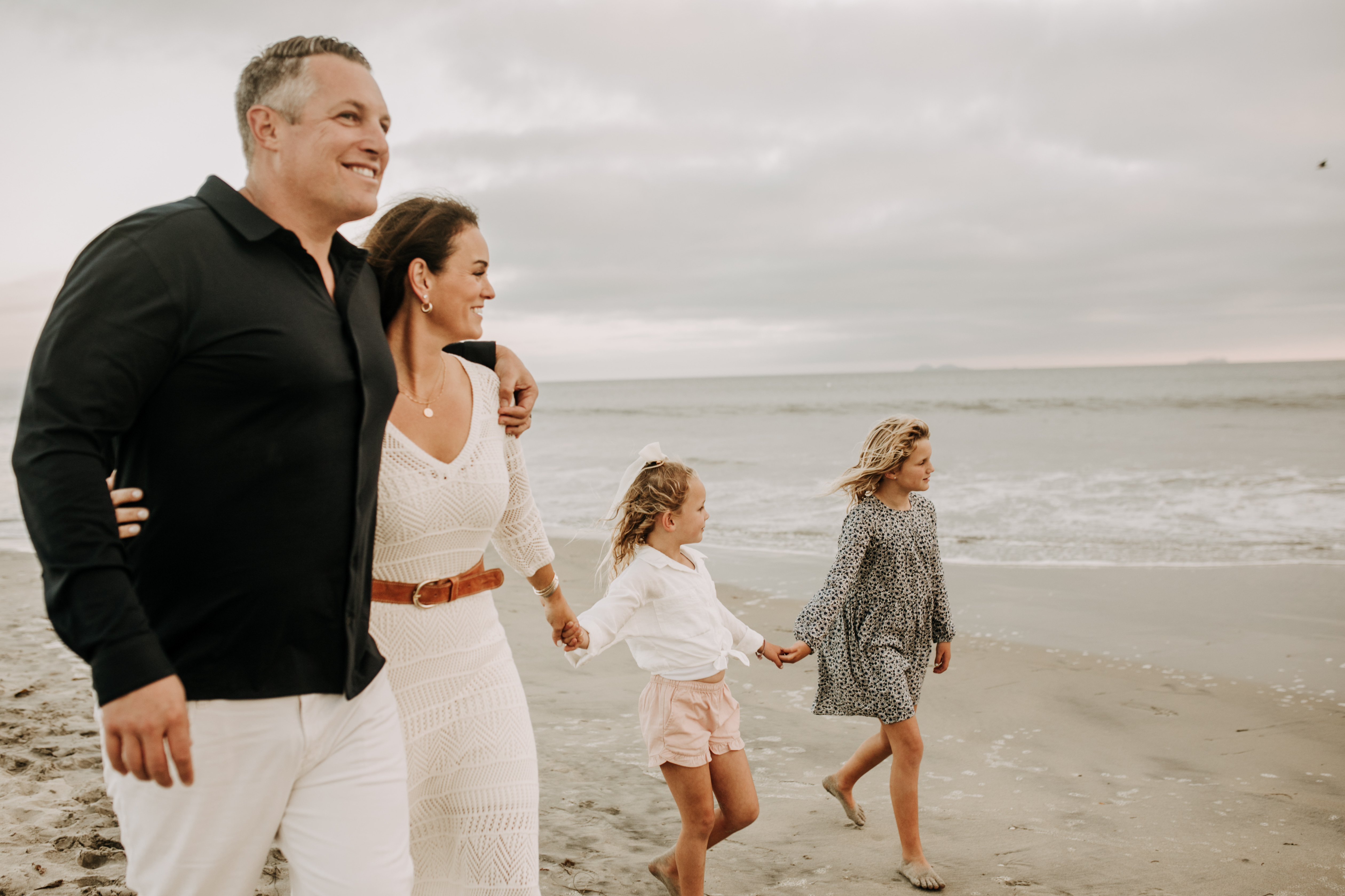 cool toned family photoshoot beach photos family photos on the beach cloudy vibes San Diego family photographer lifestyle photographer beach photoshoot inspo