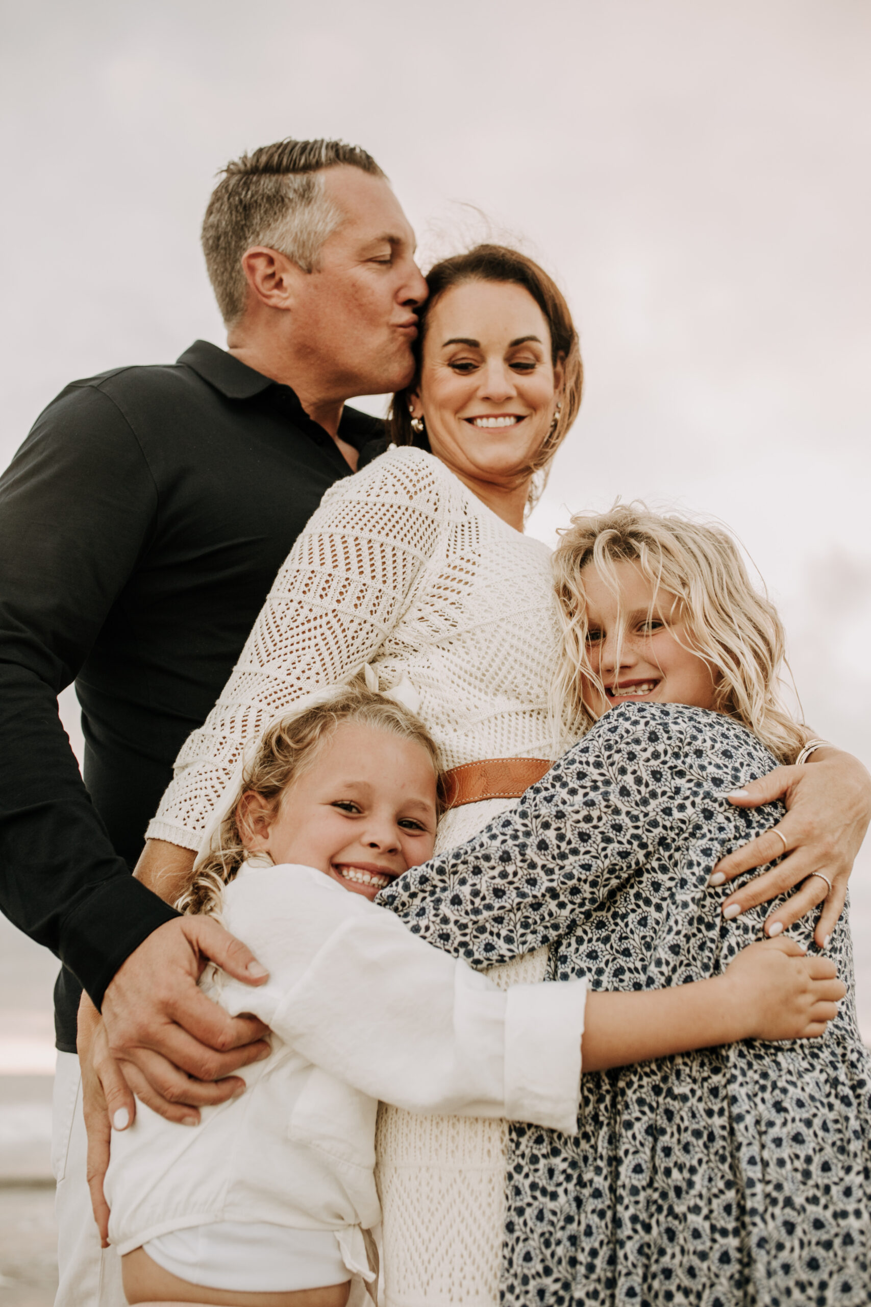 cool toned family photoshoot beach photos family photos on the beach cloudy vibes San Diego family photographer lifestyle photographer beach photoshoot inspo