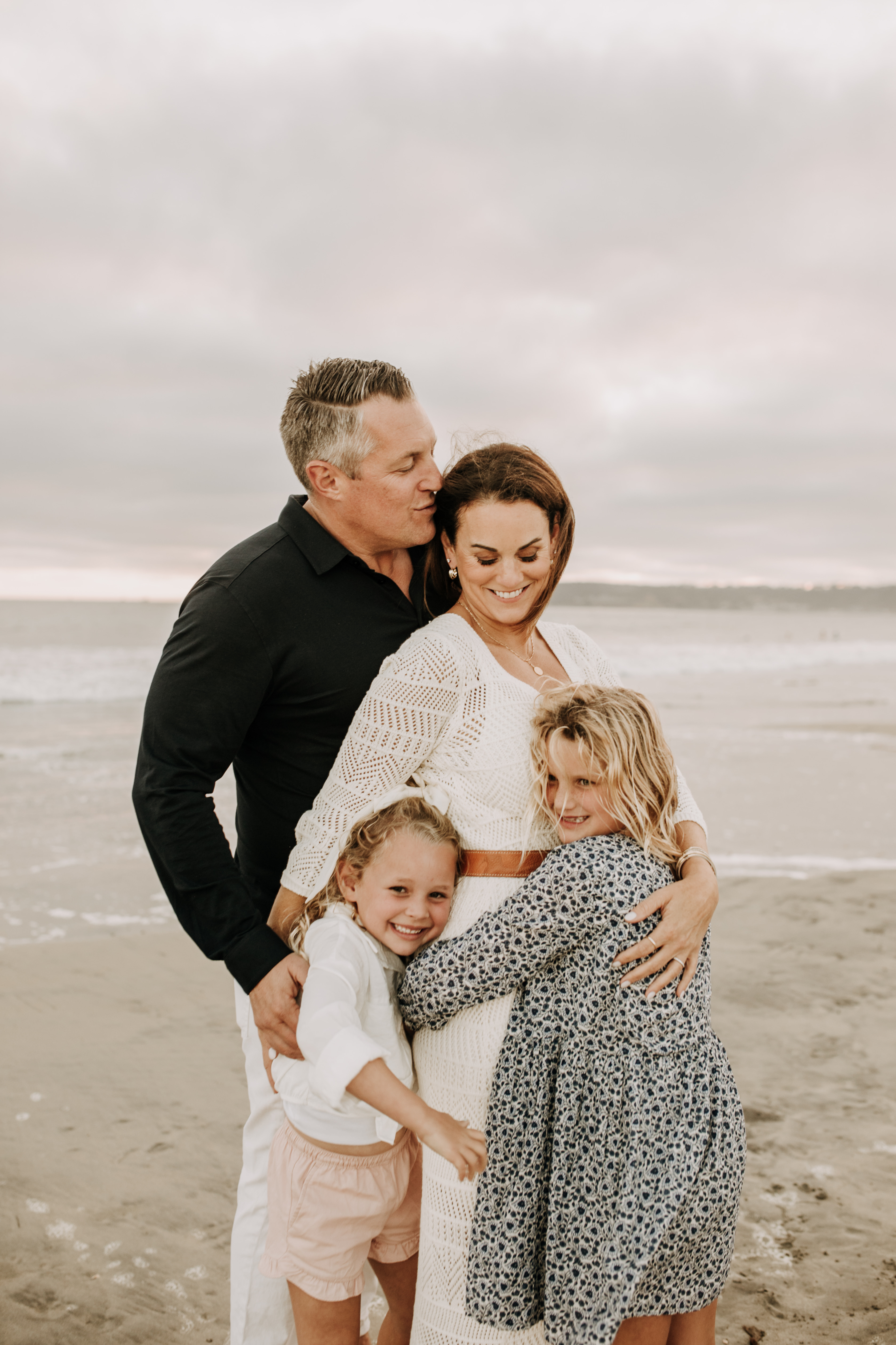 cool toned family photoshoot beach photos family photos on the beach cloudy vibes San Diego family photographer lifestyle photographer beach photoshoot inspo