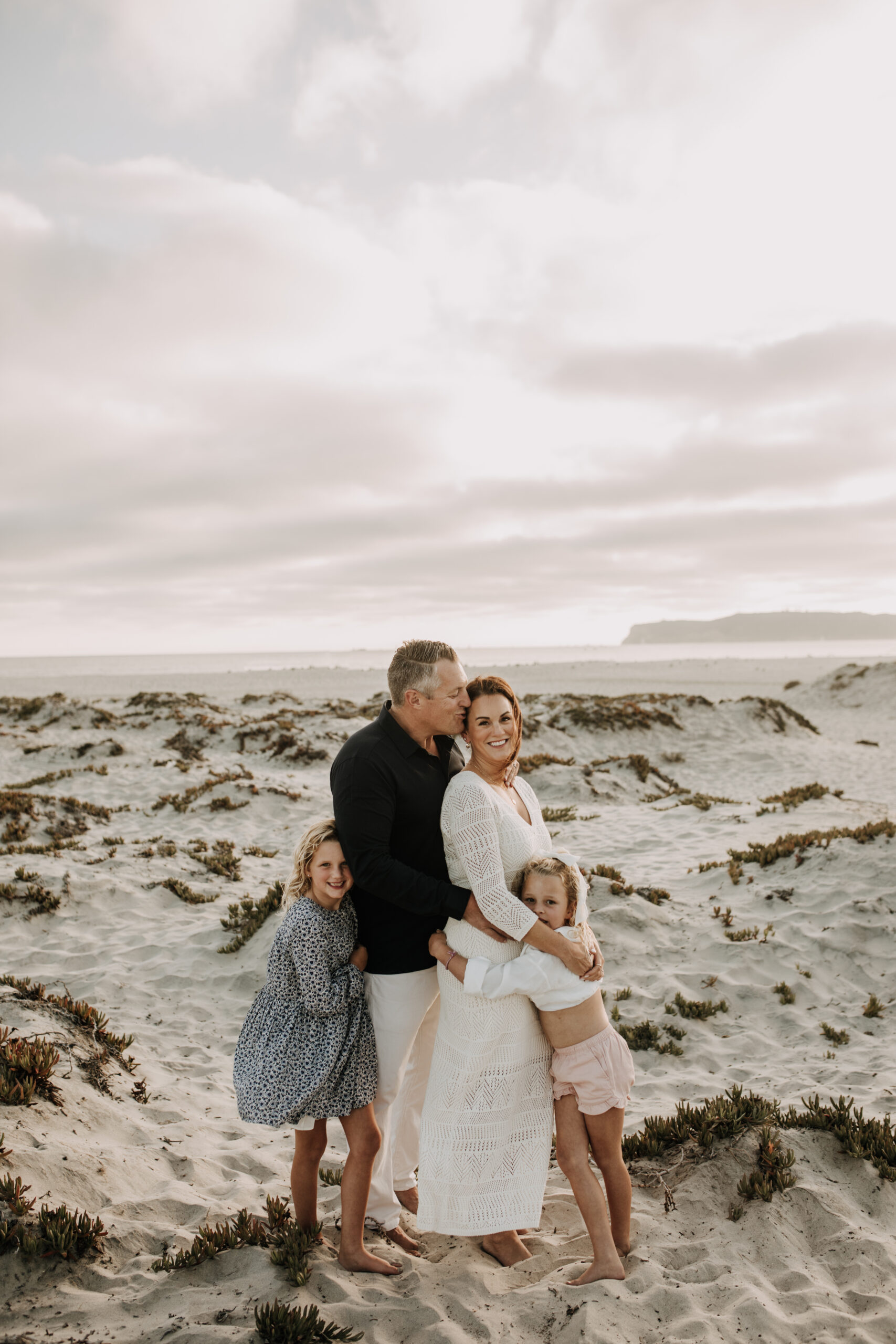 cool toned family photoshoot beach photos family photos on the beach cloudy vibes San Diego family photographer lifestyle photographer beach photoshoot inspo