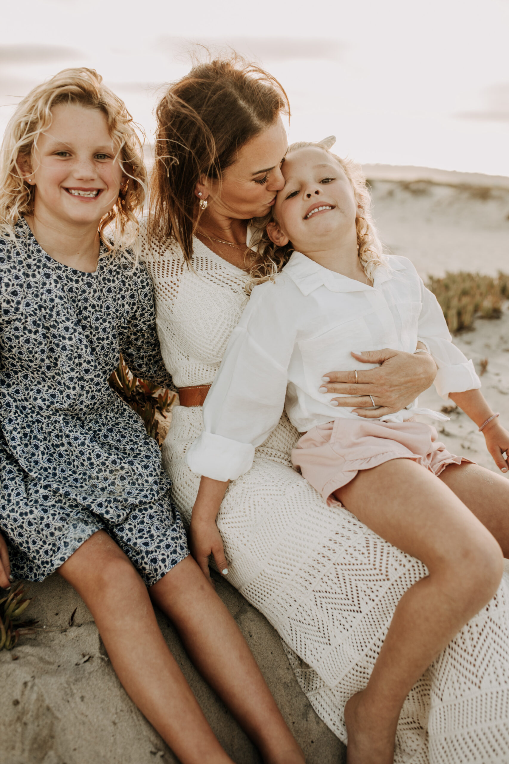 cool toned family photoshoot beach photos family photos on the beach cloudy vibes San Diego family photographer lifestyle photographer beach photoshoot inspo