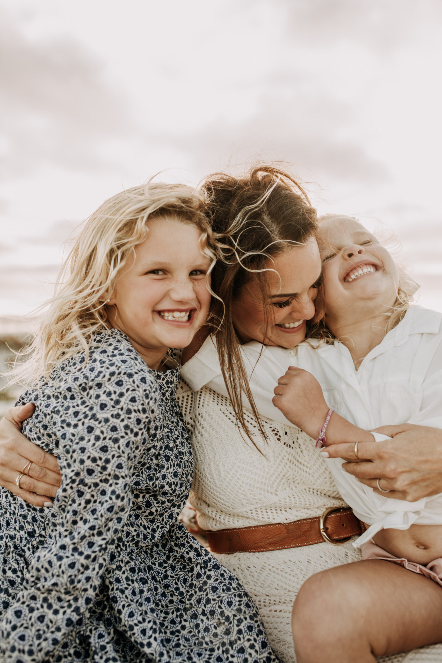 cool toned family photoshoot beach photos family photos on the beach cloudy vibes San Diego family photographer lifestyle photographer beach photoshoot inspo