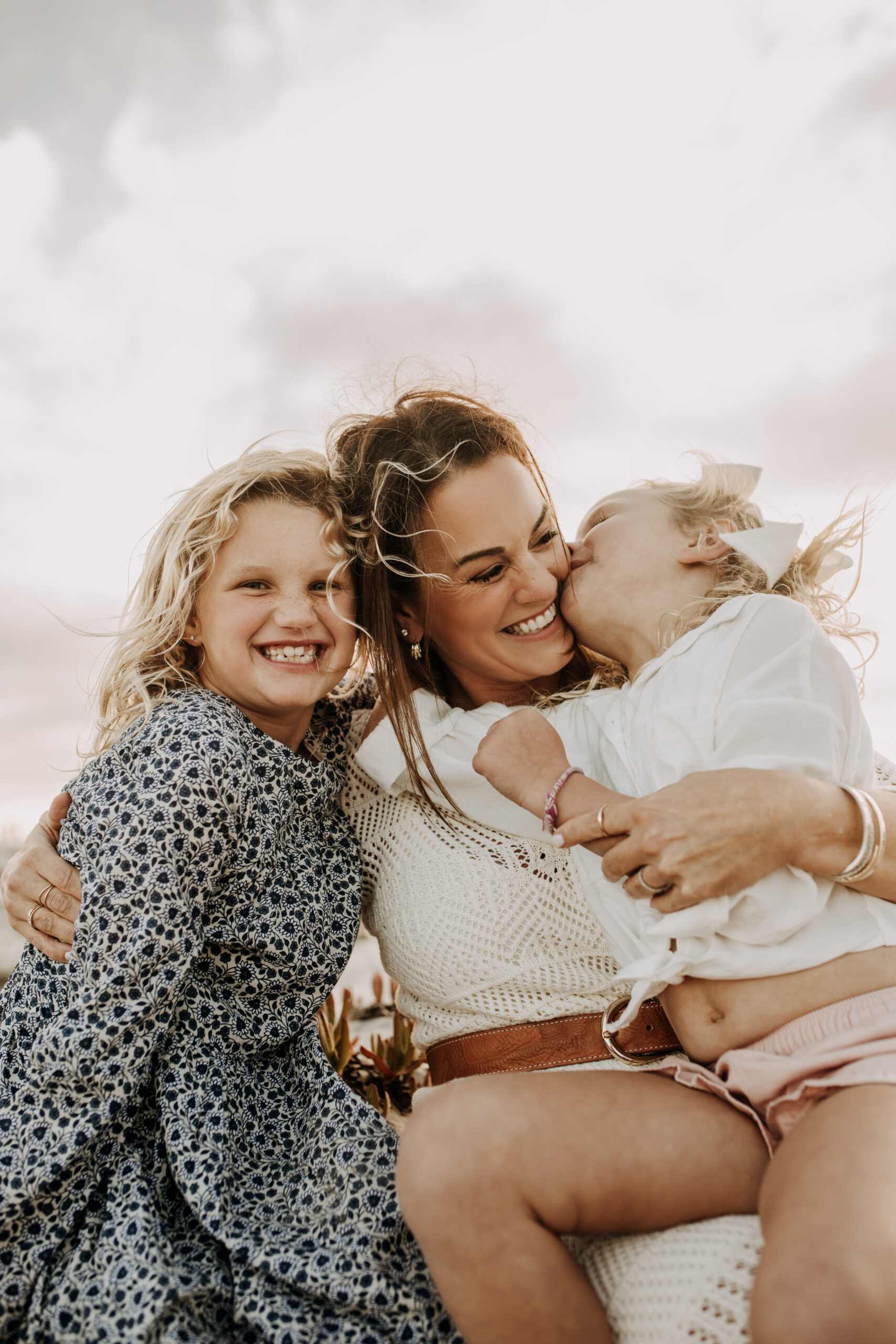 cool toned family photoshoot beach photos family photos on the beach cloudy vibes San Diego family photographer lifestyle photographer beach photoshoot inspo