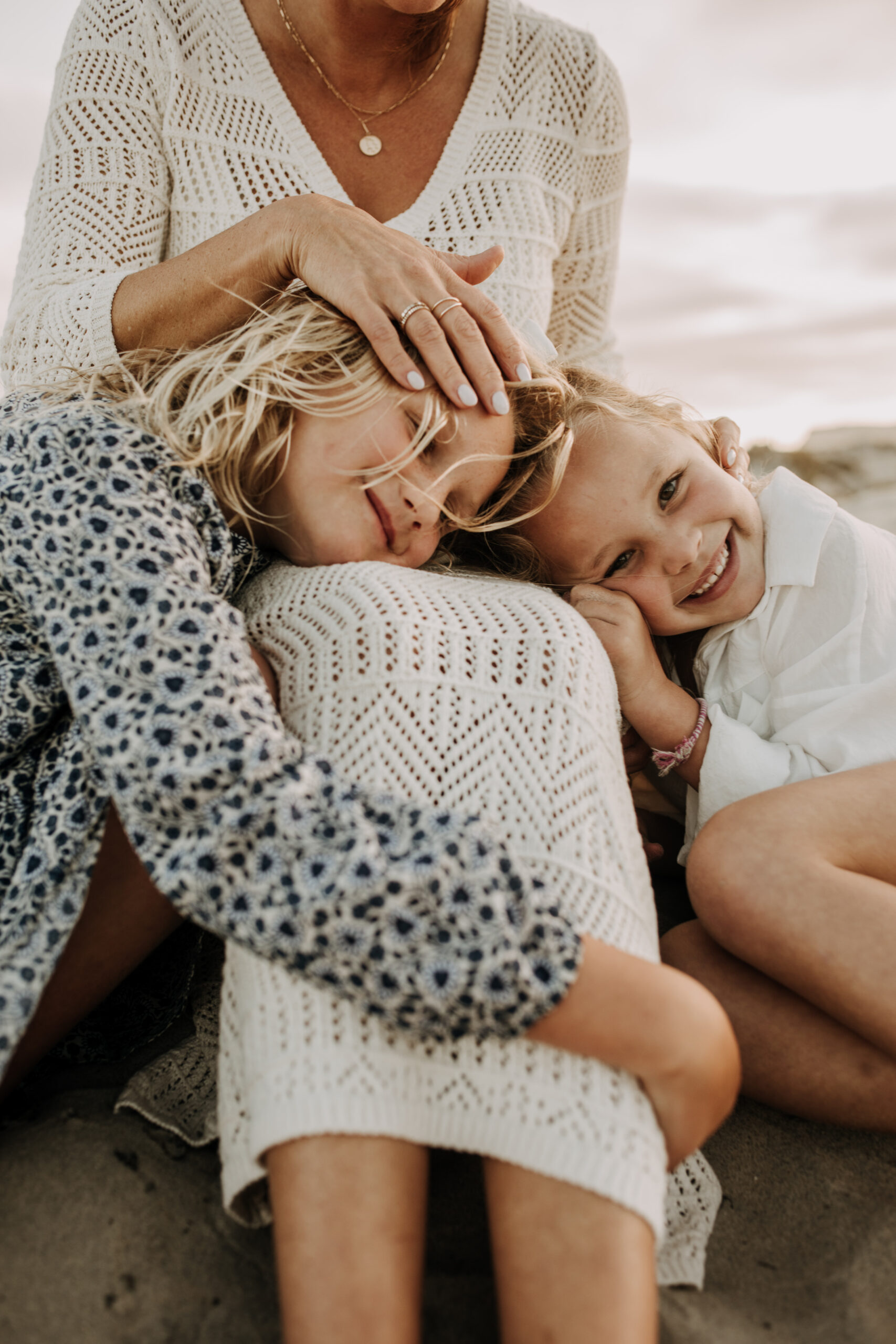 cool toned family photoshoot beach photos family photos on the beach cloudy vibes San Diego family photographer lifestyle photographer beach photoshoot inspo