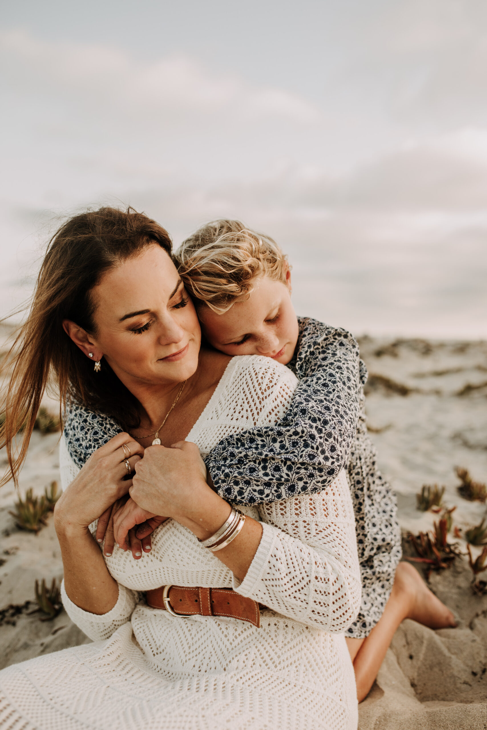 cool toned family photoshoot beach photos family photos on the beach cloudy vibes San Diego family photographer lifestyle photographer beach photoshoot inspo