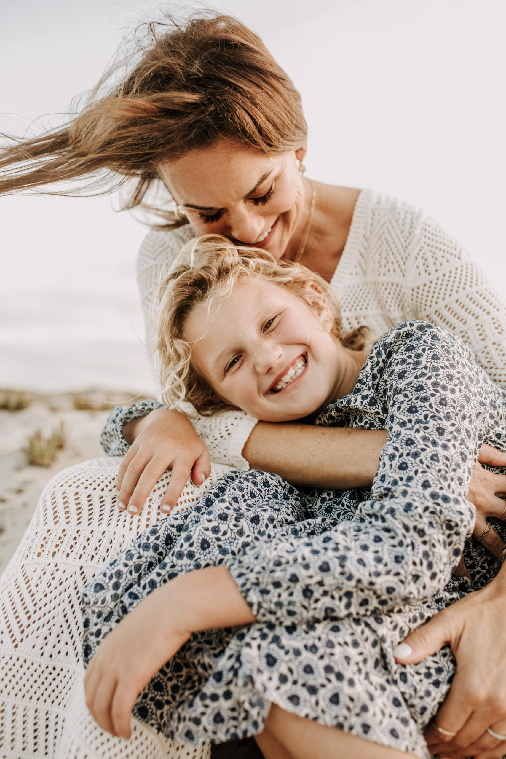 cool toned family photoshoot beach photos family photos on the beach cloudy vibes San Diego family photographer lifestyle photographer beach photoshoot inspo