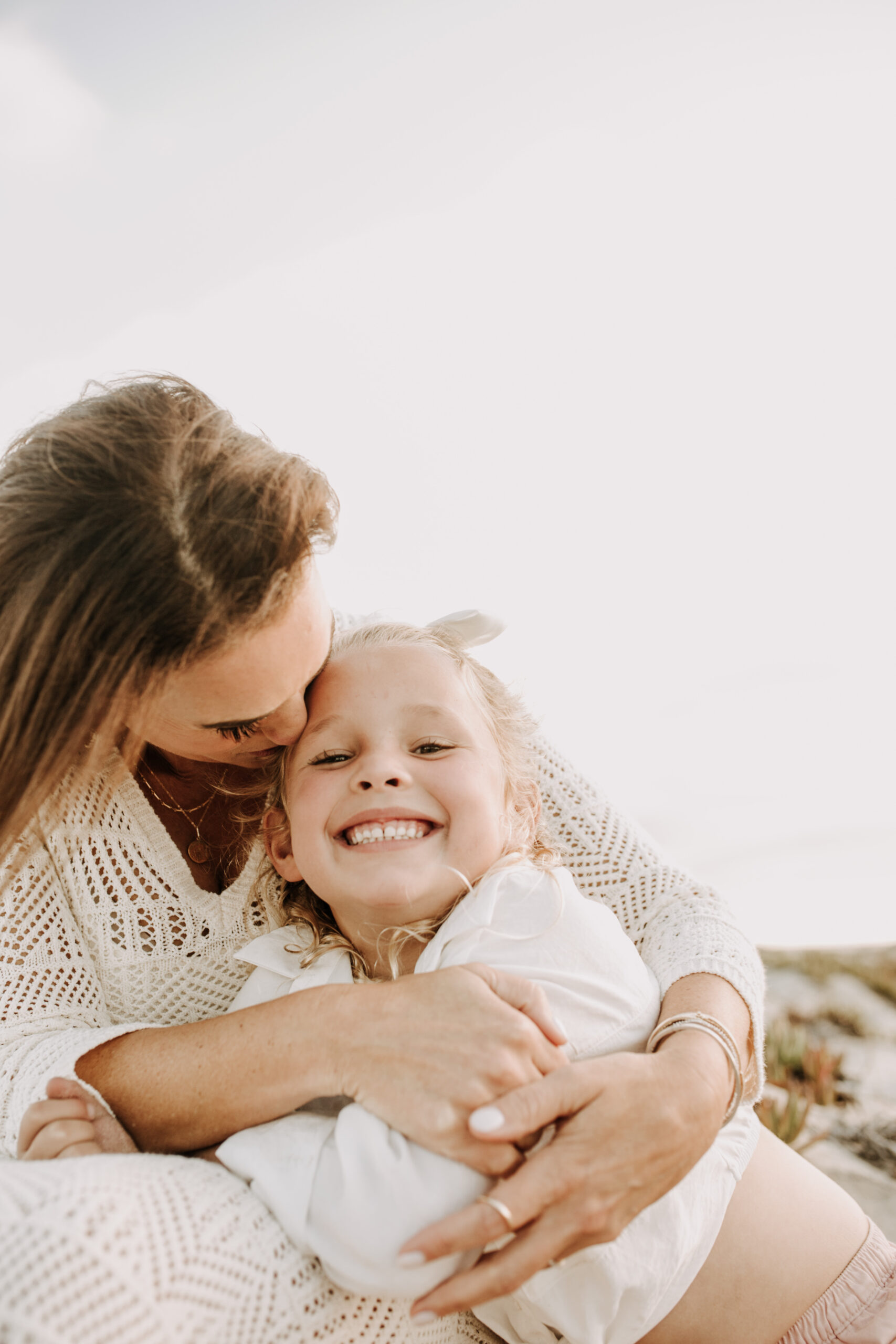 cool toned family photoshoot beach photos family photos on the beach cloudy vibes San Diego family photographer lifestyle photographer beach photoshoot inspo