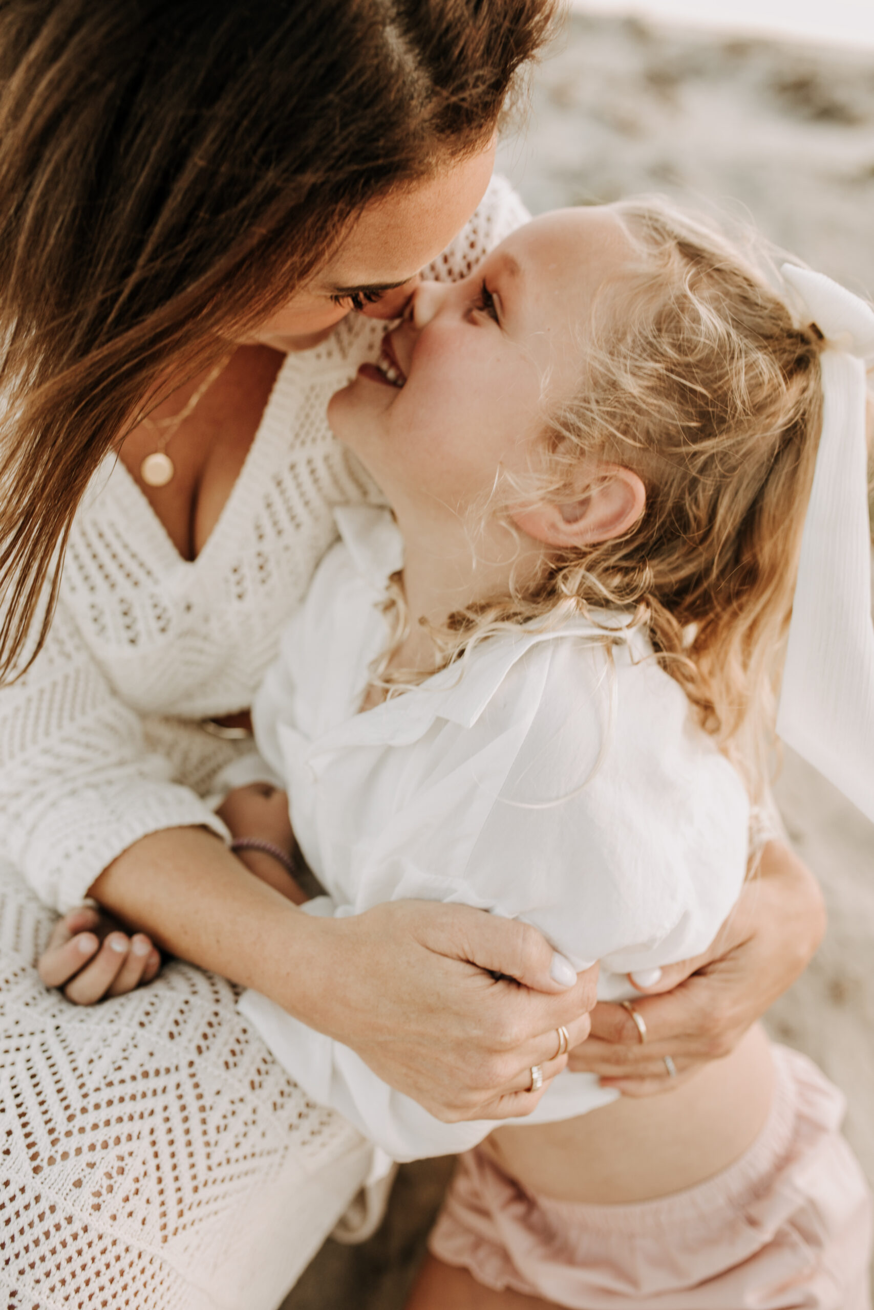 cool toned family photoshoot beach photos family photos on the beach cloudy vibes San Diego family photographer lifestyle photographer beach photoshoot inspo